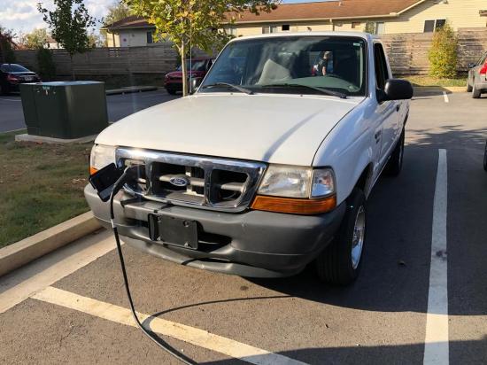 Electric Ford Ranger conversion charging through a cable at the front grille